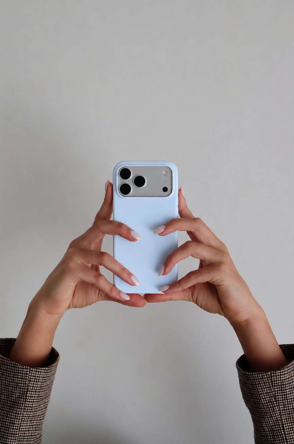 Hands holding a phone, ready to shoot content
